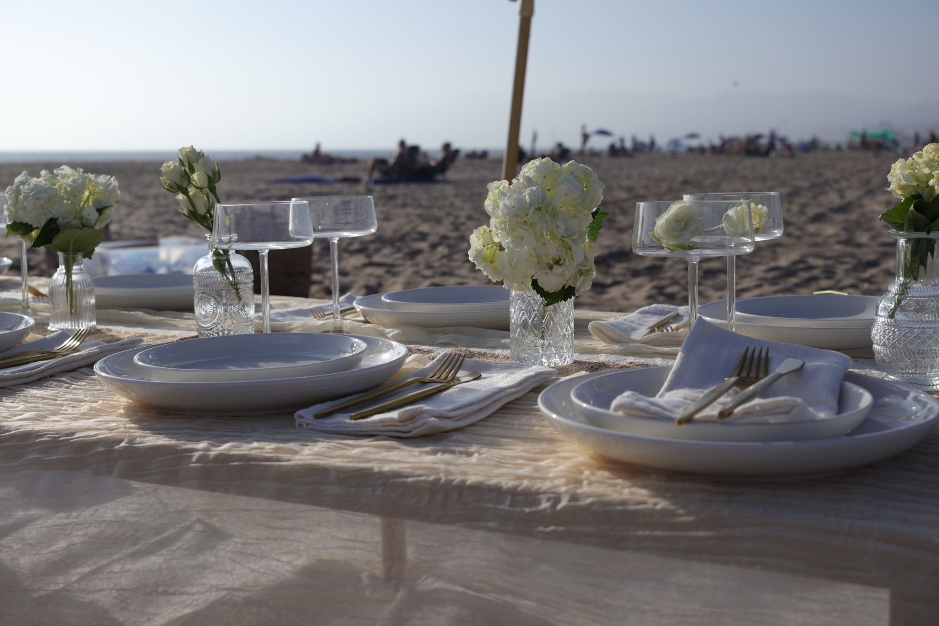 Cream tableware beside the ocean